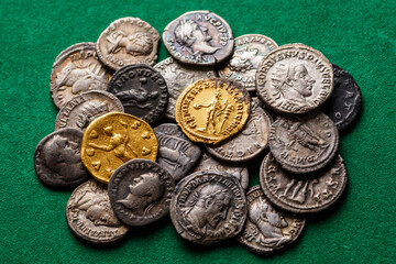 A treasure of Roman gold and silver coins.Trajan Decius. AD 249-251. AV Aureus.Ancient coin of the...