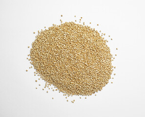 Raw quinoa seeds on a white background