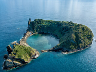 Azores aerial panoramic view. Top view of Islet of Vila Franca do Campo. Crater of an old underwater volcano. Sao Miguel island, Azores, Portugal. Heart carved by nature. Bird eye view.