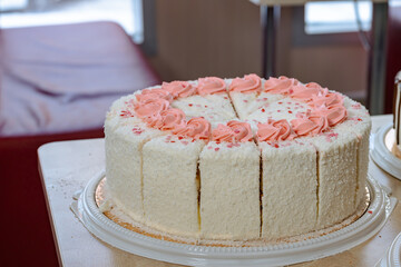 delicious sweet white cake with butter cream on a table in a roadside cafe