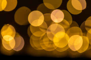 Abstract background of the blurred lights with bokeh effect