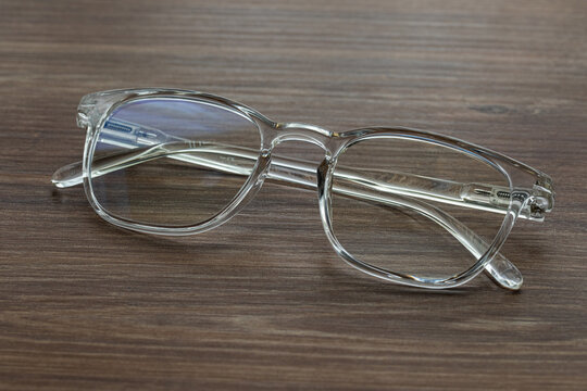 Glasses for vision with dioptria on the wooden table office