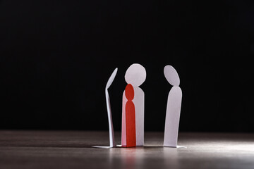 Child bullying concept with paper cutouts and dark background