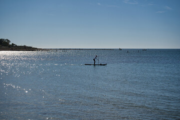 Naklejka premium paddle surfing on the beach, located in Alicante, Spain.