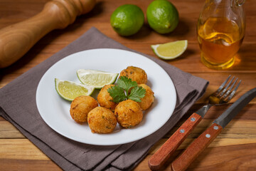 Cod dumpling. Traditional brasilian snack. Bunuelos de bacalão.