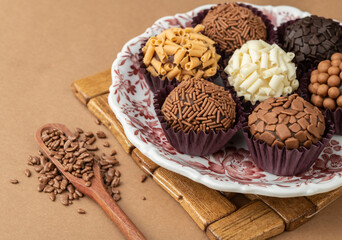 Typical brazilian brigadeiros on a plate with chocolate sprinkles