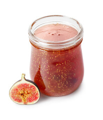 Jar of sweet fig jam on white background