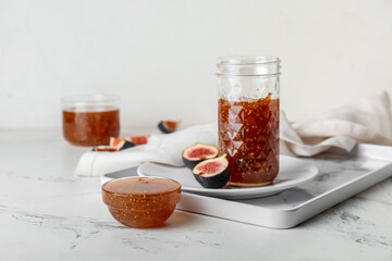 Sweet fig jam on white table