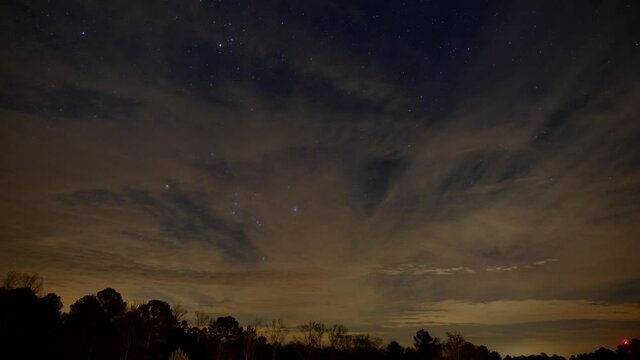 Clouds and stars on night sky, time lapse