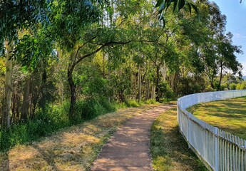 Fototapeta na wymiar Local Suburban white cricket field fence in Blue Hills, Glenmore Park, Australia