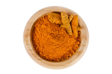 Turmeric powder spice heap in a wooden bowl with turmeric roots isolated on a white background. Top view.