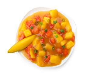 Bowl with tasty mango salad and sauce on white background