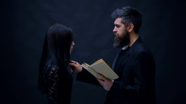 Priest and prayer with woman. Girl is praying preaching pastor with bible book.