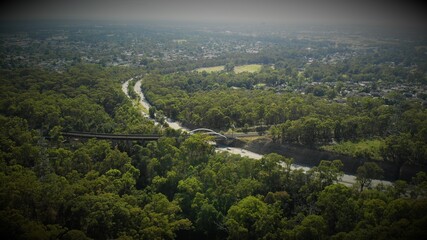 Drone image of the m4 motorway leading into the Blue Mountains from Western Sydney on a sunny day.