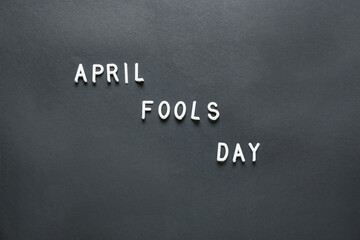 Obraz premium Text APRIL FOOLS DAY on dark background