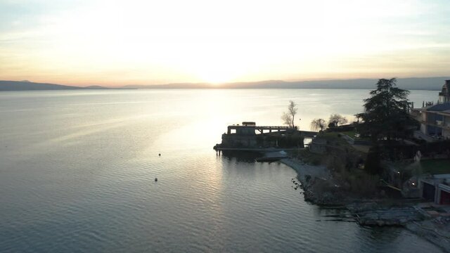 Aerial of boat docks on lake at sunset