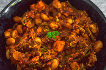 vegan autumn hot pot with sweet potato green beans buttter beans and capsicums, healthy plant-based food