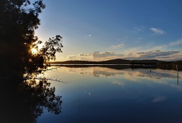 Mirror reflection on Queens Lake in Laurieton, New South Wales, Australia