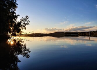 Mirror reflection on Queens Lake in Laurieton, New South Wales, Australia