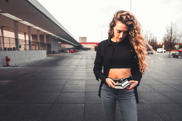 Obraz premium Young person checking a wallet with euros and cards
