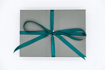 A gift box with a bow tied