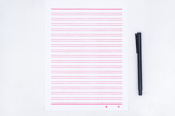 Stationery and a black pen