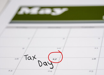Calendar with Tax Day note inserted in the date for May 17 to illustrate the new tax return filing date of f17th May 2021.