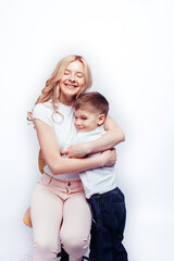 young modern blond curly mother with cute son together happy smiling family posing cheerful on white background, lifestyle people concept, sister and brother friends