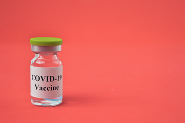 Covid-19 bottle vaccination over red background