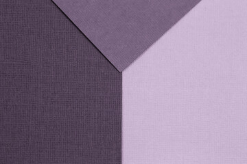 Geometric paper background from purple. Copy space, place for your text. Top view.
