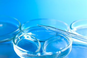 Medical abstract background. Petri dishes and glass pipette.