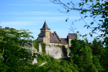 Fototapeta na wymiar Old fortress in spring. Impressive gothic castle and walls. Architecture. 