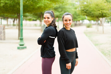 Obraz premium Happy workout partners in activewear exercising outdoors