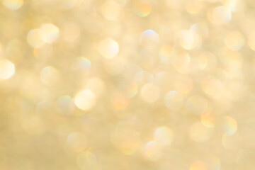 bright glitter background: bokeh effect from many colored lights on frozen glass, toning