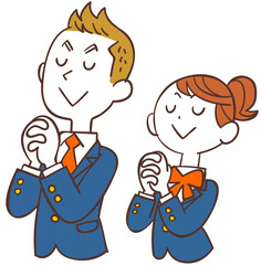 祈る男女の学生の上半身
