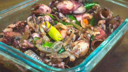 Indonesian traditional dishes, seafood spicy calamari served in the glass bowl