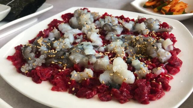 'Yukhoe Tangtang ee' is a Korean dish that with raw beef and live octopus.