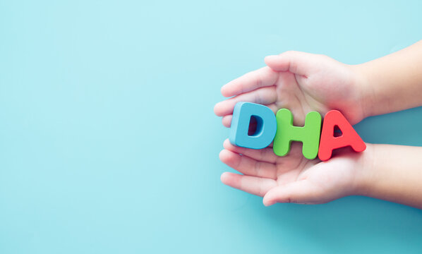 Docosahexaenoic acid (DHA) on kid hand.Brain and visual functions.milk.Calcium dha vitamin from milk.Milk breast.Omega3, Fish oil, Vitamin healthcare medical.Pharmacy chenimstry, collagen.Child kid.