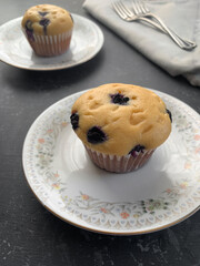 Vintage berry muffins in grey background