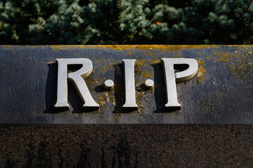 R.I.P. letters on a tombstone