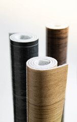 Linoleum. Three rolls of linoleum on a white background.