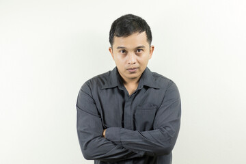 Portrait of a dark-skinned Asian man in business attire, a man with slight hair loss.