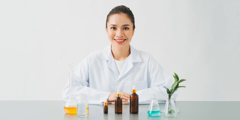 scientist or doctor making herbal medicine with herb leaves , capsule, tablets.hands.