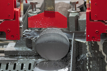 Metal band sawing machine in a factory. Industrial automatic band saw machine for metal cutting for...