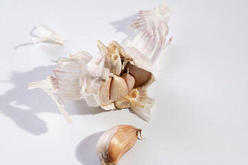 dry garlic on white background, alternative medicine