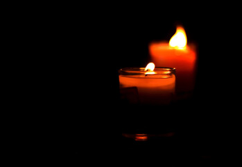 The light of the candle flame during the dark night. Beautiful light of candle in dark night. Light from candle of love for couple sweet in romantic night.