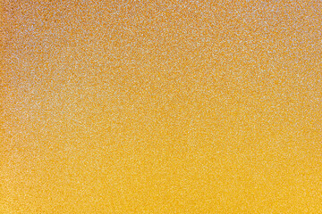 Abstract defocused gold glitter texture background with copy space for text or lettering. Minimal gradient composition. Mock up, festive background.