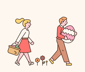 Easter characters. A boy and a girl are walking with Easter eggs in their hands.  flat design style minimal ve