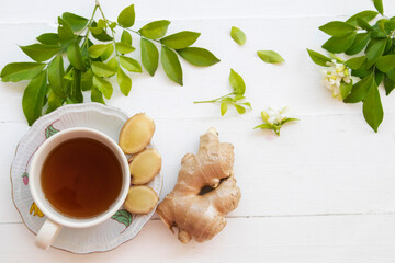 herbal drinks ginger health care sore throat with flowers jasmine arrangement flat lay style on...