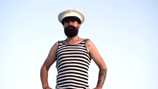 Portrait of adult man in vest. Bearded sailor. Longing for the sea, memories.
